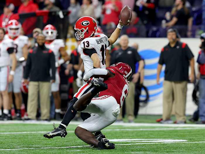 Stetson Bennett fumbles the ball as he's hit